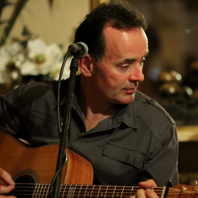Cyril Moran playing guitar